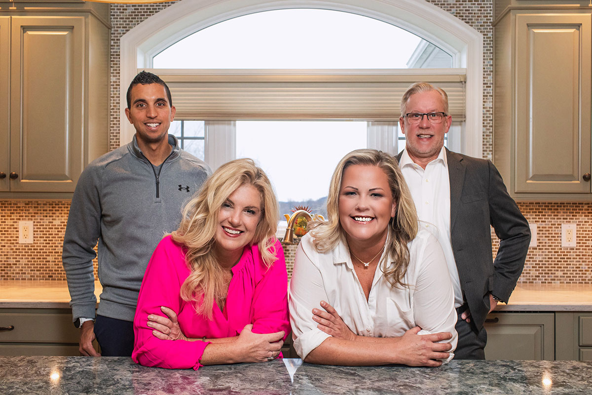 Afb-Blog-Gallery-Afb-Team-020 The afb team posing in a modern kitchen in pittsford, ny — trusted real estate experts serving rochester, brighton, and monroe county home buyers and sellers.