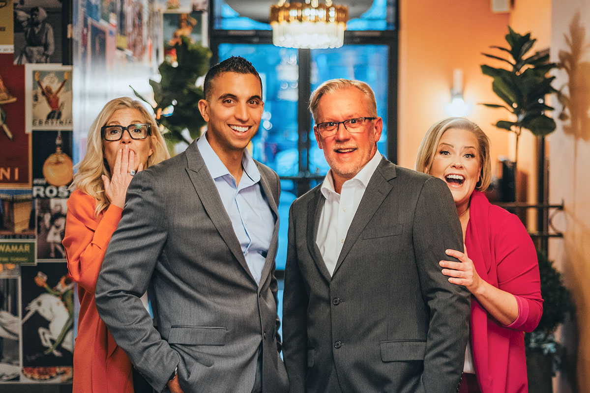 Afb-Blog-Gallery-Afb-Team-022 The afb team posing in a foyer of a restaurant in rochester, ny — trusted real estate experts serving rochester, brighton, and monroe county home buyers and sellers.