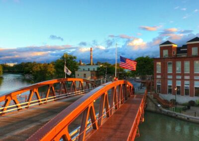 A bridge over a river with a flag