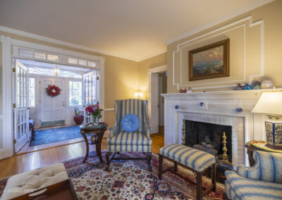 Attractive interior of a brighton, ny home with fireplace and impressive foyer