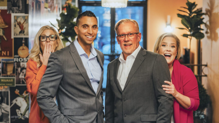 Afb Team 001 The afb team posing in a foyer of a restaurant in rochester, ny — trusted real estate experts serving rochester, brighton, and monroe county home buyers and sellers.