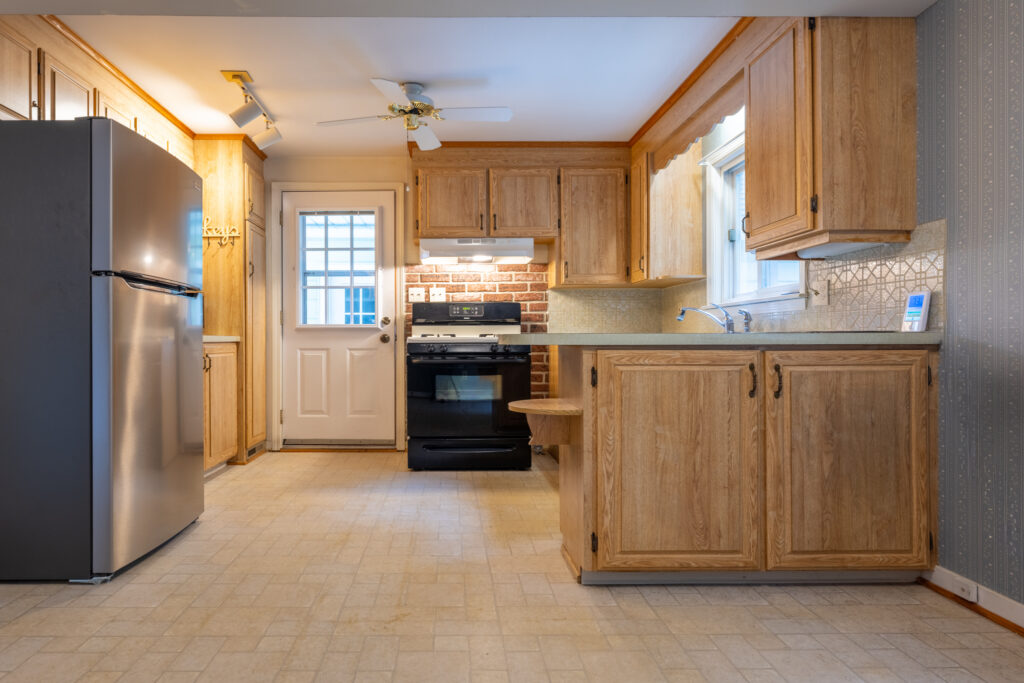 9 Brewster Lane, Rochester, NY 14624 3 Eat-in kitchen at 9 Brewster Lane in Gates, NY with wood cabinetry