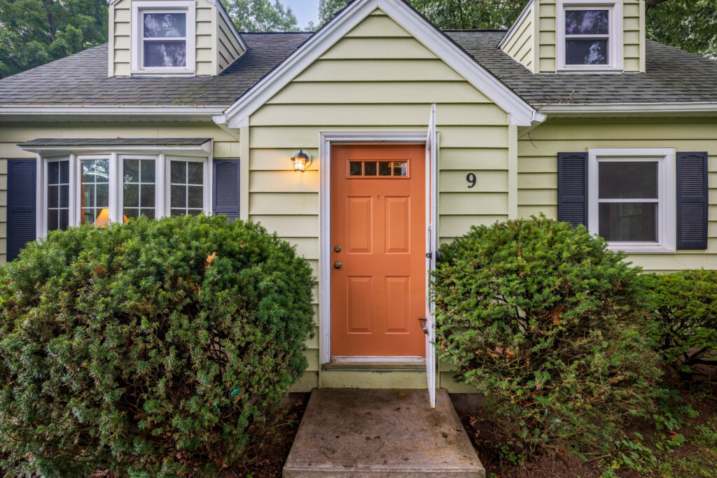 9 Brewster Lane, Rochester, NY 14624 1 Front entrance of 9 Brewster Lane in Gates, NY with classic Cape Cod exterior